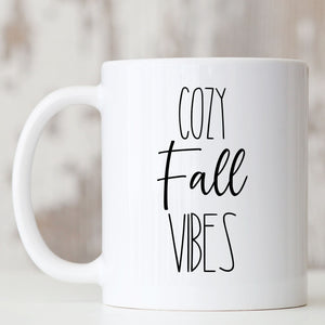 Picture of 11oz. All white Coffee mug with Cozy Fall Vibes in black letters