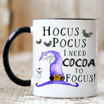 Load image into Gallery viewer, Picture of our 11oz Black Handle Coffee Mug with Graphic of Hocus Pocus I Need Cocoa To Focus on front of mug.
