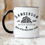 Load image into Gallery viewer, Picture of our 11oz Black Handle Coffee Mug with Graphic of Sanderson Witch Museum on front of mug.
