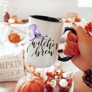 Picture of 15oz Black Handle Coffee Mug with Witches Brew graphic for Halloween. Witches Hat is Purple.