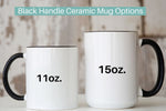 Load image into Gallery viewer, Picture of all white mug with a black handle and black rim featuring our 11 ounce mug and our 15 ounce mug options.
