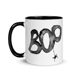 Picture of 11oz Black Handle Coffee Mug with Boo graphic for Halloween. A black Spider hangs from the "o" 