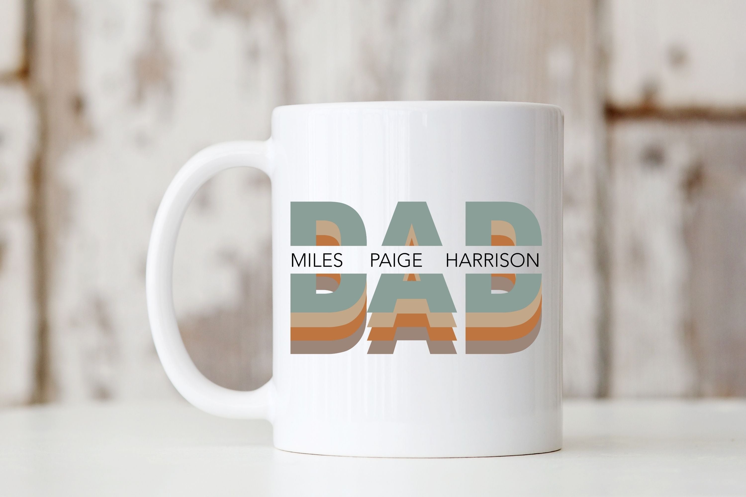 Picture of our All White 11oz Coffee Mug with Graphic Dad with names of kids in center, on front of mug