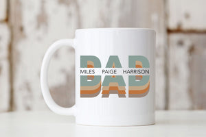 Picture of our All White 11oz Coffee Mug with Graphic Dad with names of kids in center, on front of mug