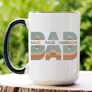 Picture of our 15oz Black Handle Coffee Mug with Graphic of Multi Color Dad with kids name in center, on front of mug.