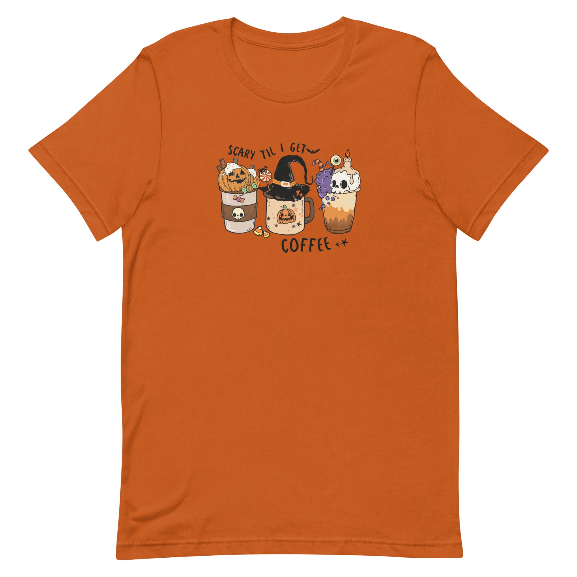 Autumn colored women's t-shirt for halloween with graphic of three coffee drinks, one with a pumpkin, the center with a witches hat and the last with a skull candle.