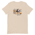 Load image into Gallery viewer, Soft cream women&#39;s t-shirt for halloween with graphic of three coffee drinks, one with a pumpkin, the center with a witches hat and the last with a skull candle.
